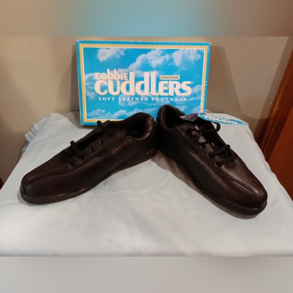 Black leather shoes.  New